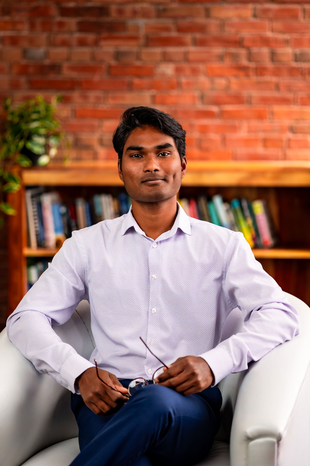 Callie Croken, a life and business coach, sipping coffee playfully in a window sill during her branding photoshoot with Lake Design.